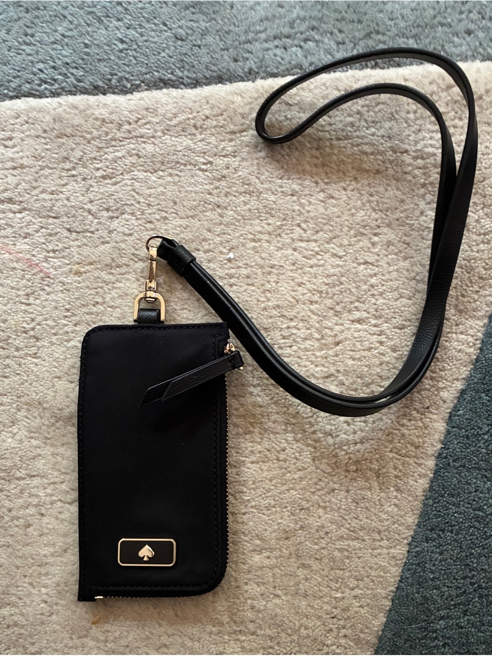 kate spade black lanyard with card slots and zipper pocket